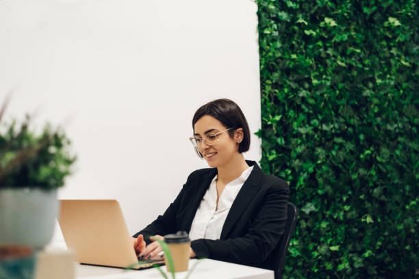 istock Business working on a laptop in a creative office environment 1393883166