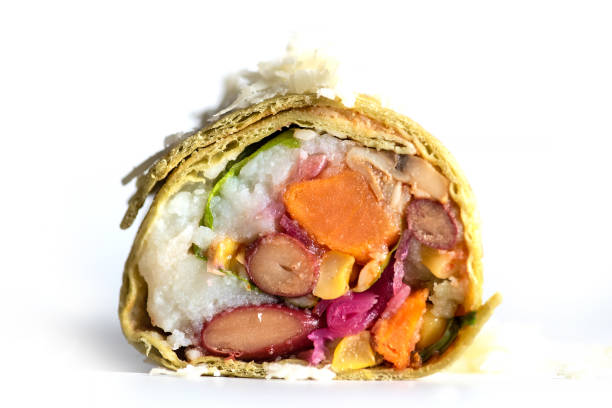 Grilled burritos wrap with vegetable with beans,corn,tomatoes,avocado sweet potatoes isolated on white.