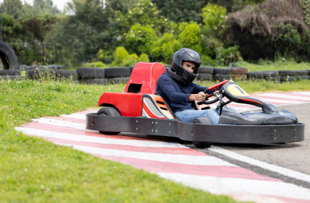 istock Man racing in go-carts and skidding while making a turn 1393884670