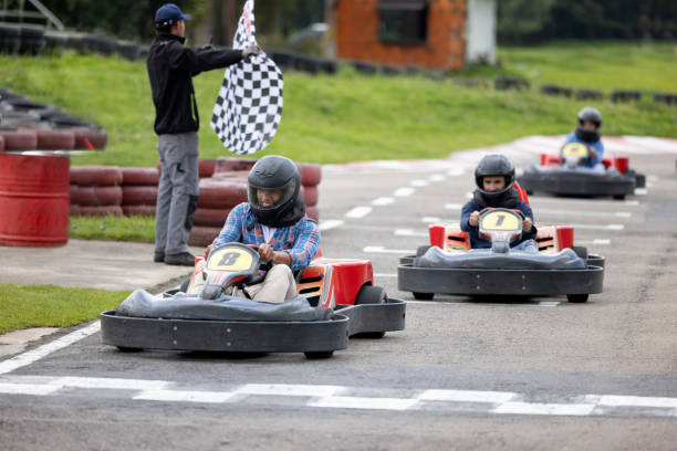 istock Men go-carting and competing to win the first place 1393884704