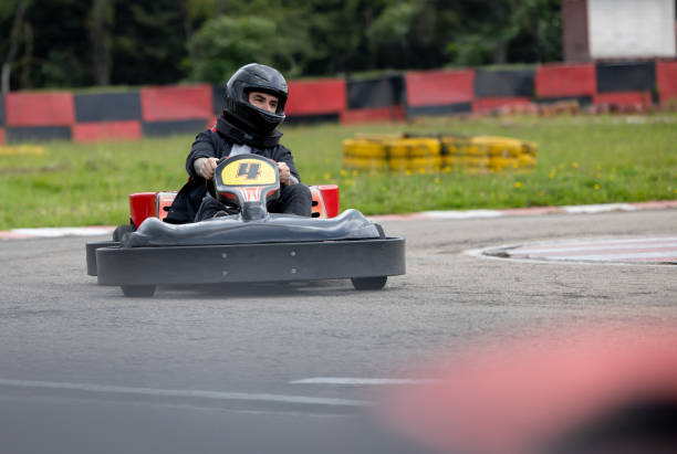 istock Man racing in go-carts 1393884711