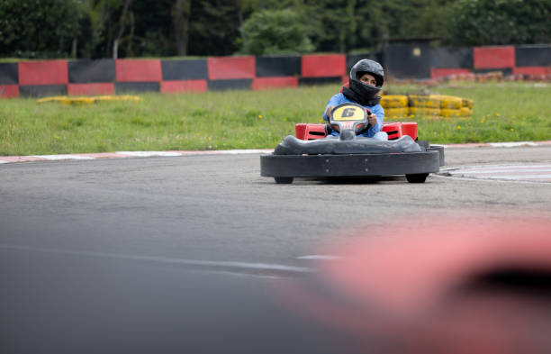 istock Woman having fun go-carting 1393884734