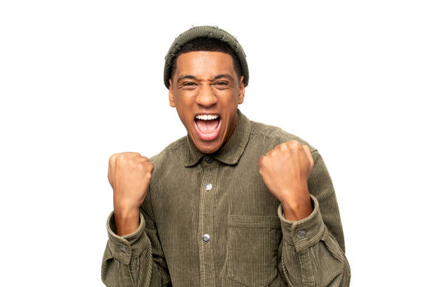 istock Excited overjoyed man shouting making yes gesture, amazed with his victory, triumph. Indoor studio shot isolated on white 1393884823