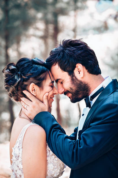 istock Wedding couple posing in forest. 1393885957