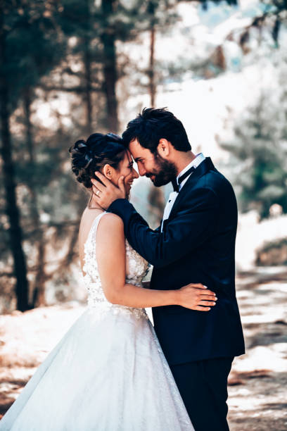 istock Wedding couple posing in forest. 1393885986