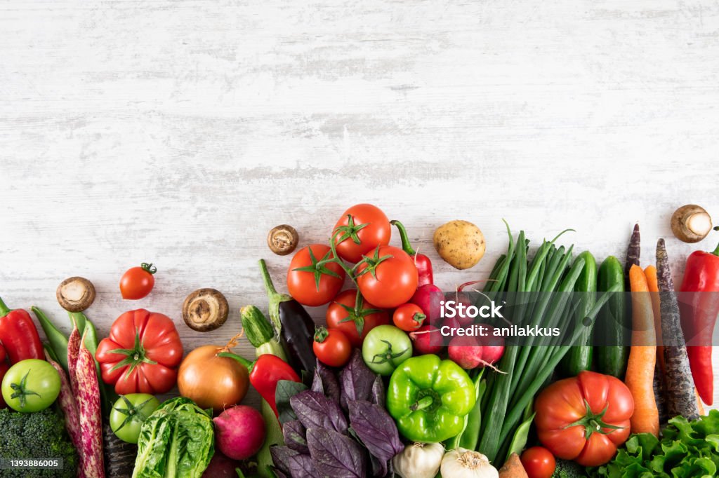 Fresh Vegetables on White Wooden Table Fresh and raw vegetables on white wooden table with copy space Vegetable Stock Photo