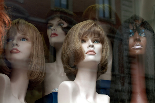 wigs in window