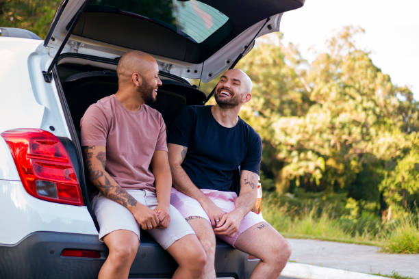 Two men in a white car. stock photo