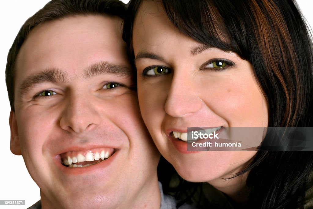 Couple - Smile Portrait of man and woman. Main focus is on the woman. Adult Stock Photo