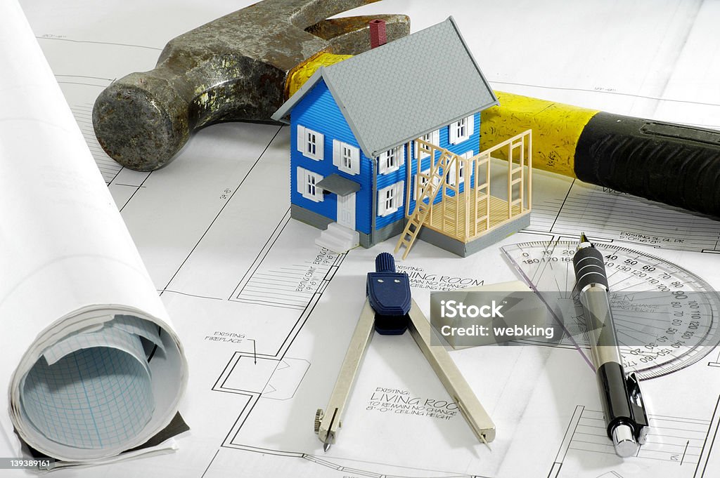 Home Renovation Miniature House With Various Drafting Items and Plans. Architecture Stock Photo