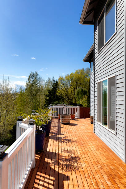 istock Home outdoor cedar wooden deck just stained for during early spring 1393893426