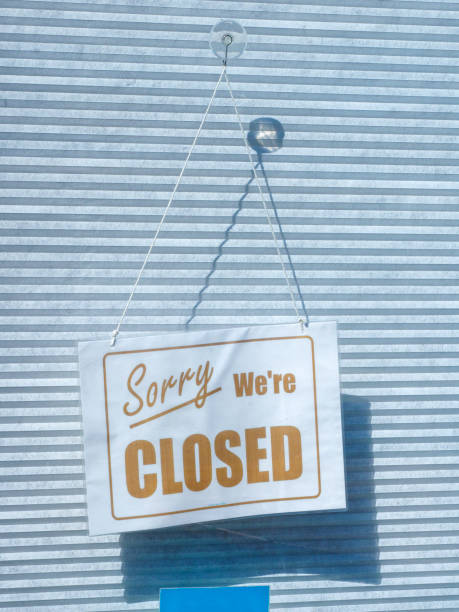 istock Closed Sign in a Shop Window 1393894328