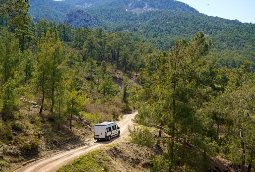 Motorhome driving through forest road near Antalya, Turkey