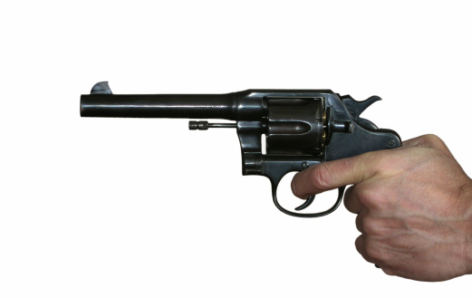 Aimed revolver in hand