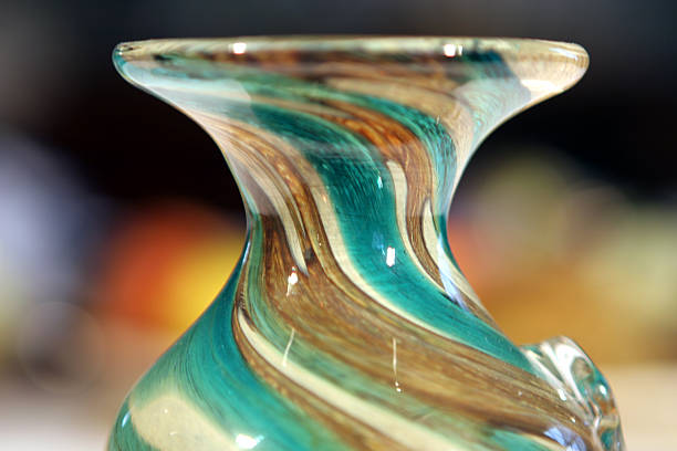 istock Hand blown glass vase, with swirling colours 139389687