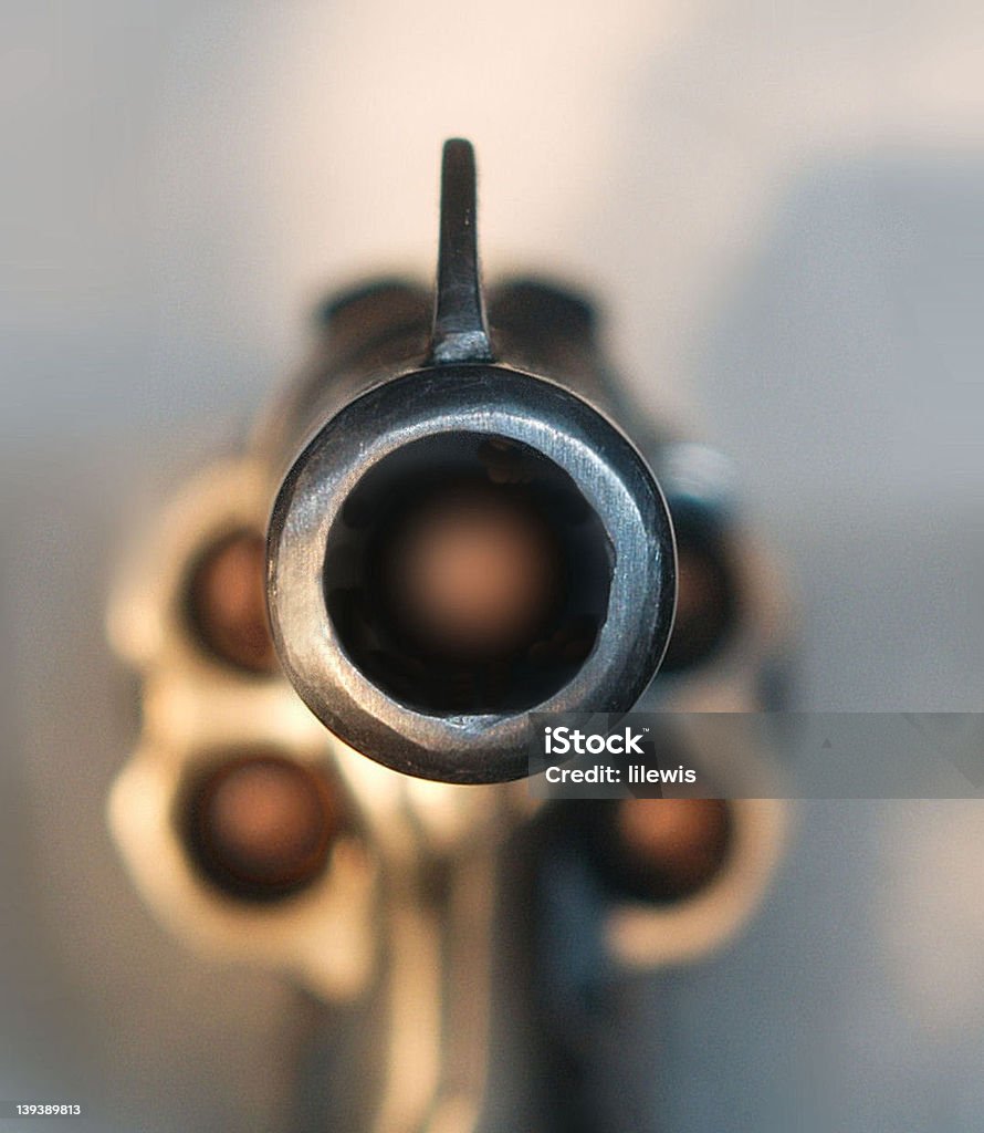 Loaded revolver pointed at viewer Loaded gun pointed at viewer Aiming Stock Photo