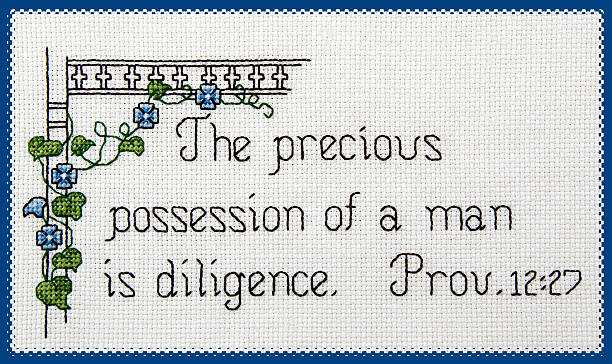 Scripture: Counted Cross Stitch on Diligence stock photo