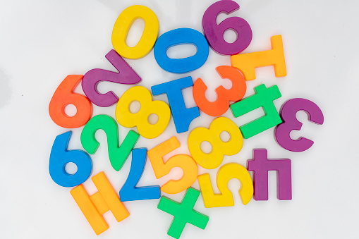 Colorful plastic numbers on a white isolated background