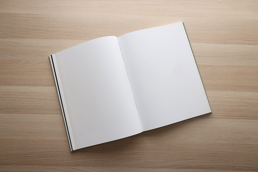 Blank open book on table
