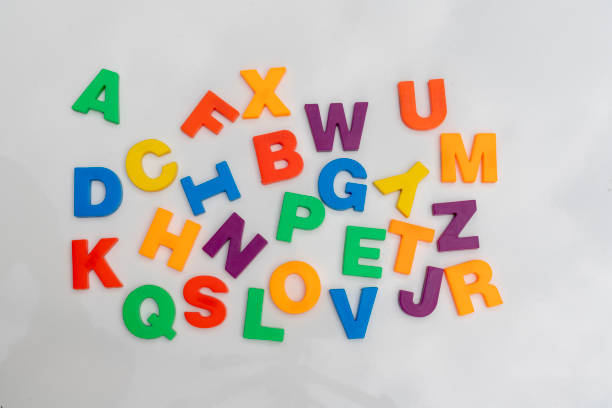 istock Alphabet letters in a random order on a white background 1393899924