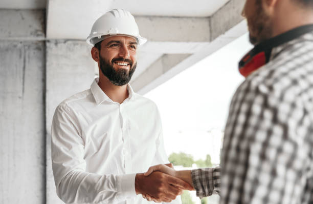 istock Contractor shaking hand of colleague 1393901717