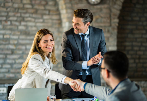 istock Business people shaking hands after a meeting 1393903184
