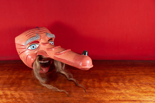 istock Typical Mask of Cuzco with red background 1393904253