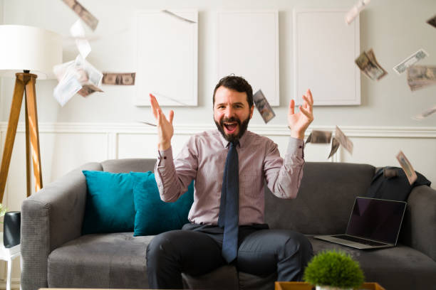 istock Wealthy man celebrating financial freedom 1393904381