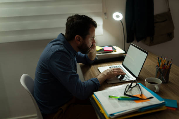 istock Stressed man trying to finish a project 1393904923