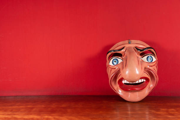 istock Typical Mask of Cuzco with red background 1393904955