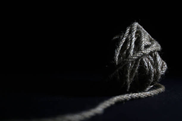 Ball of yarn, black background