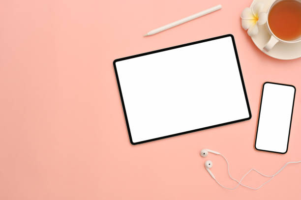istock Pink workspace background with tablet and smartphone mockup 1393912437