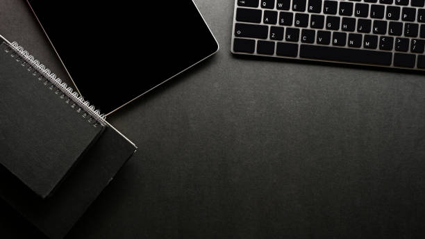 istock Top view, Modern hipster dark office workspace with copy space 1393912479