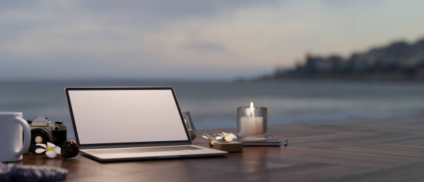 istock Remote working on holiday vacation concept with laptop mockup 1393912482