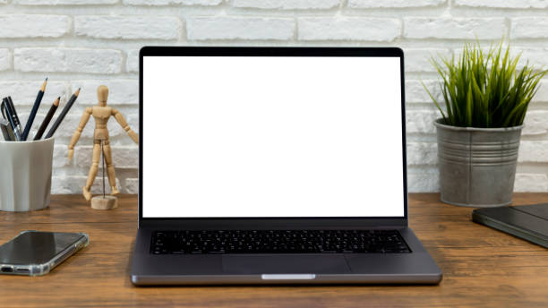 istock mock up empty screen computer on wood desk, Laptop computer with blank white screen on table in office.with clipping path 1393916133