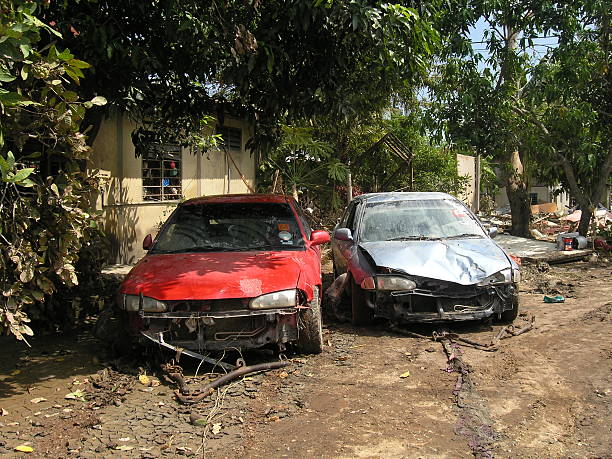 Cars destroyed by natural disaster After a natural disaster, many cars were wrecked. The impact of the tragedy was truly unleashed 2004 indian ocean earthquake and tsunami stock pictures, royalty-free photos & images