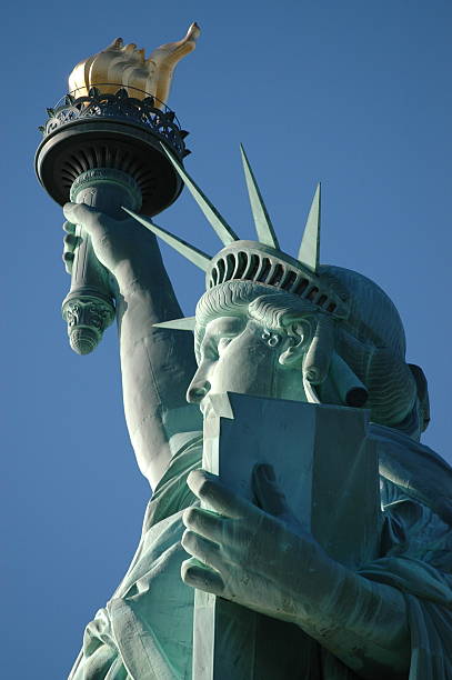 Lady Liberty-up close and personal-sunlight on fface stock photo