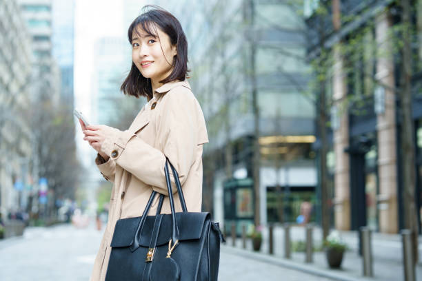 istock Woman walking in the business district 1393917730