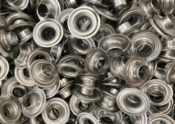 Grommets Closeup of mass produced grommets. eyelet stock pictures, royalty-free photos & images