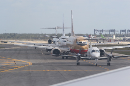 Airplanes waiting in takeoff queue