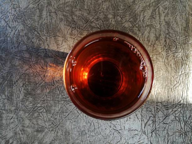 A glass of black tea with no sugar in the morning time, taste so nice. Herbal drink healthy lifestyle diet. Background template copy space. Cover magazine design layout.
