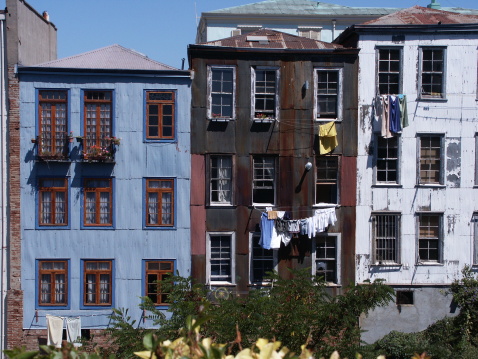 Typical painted and rustied buildings in Valparaiso harbor, Chile.