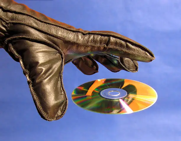 Hand grabbing cd.