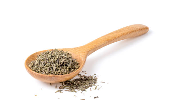 istock Dried Thyme in wood spoon isolated on white 1393931423