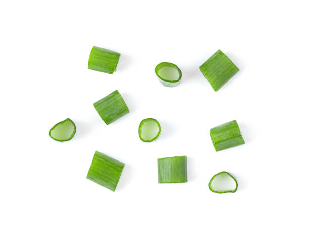 istock Green onion slice isolated on the white 1393931507