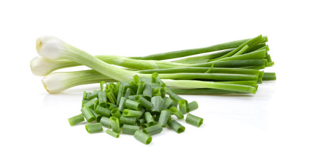 istock Green onion isolated on white 1393931567