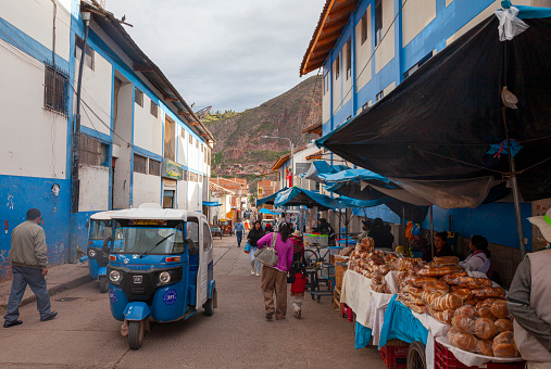 Urubamba, Sacred valley, Peru- March 2022:  Street in the center of  Urubamba, a town in the Sacred Valley of Peru, with view of the surrounding mountains.