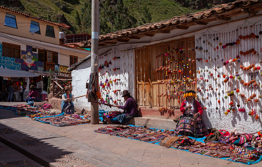 Touristic street in Pisac, Sacred valley, Peru, known for its lively handicrafts market.
