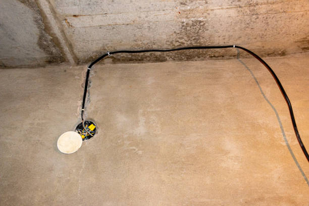 istock A light bulb with wires, on unprocessed concrete coating, in process of building a building or repair,  electrical wiring in building. 1393932834