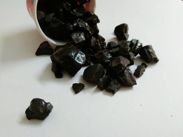 Shilajit is commonly used in ayurvedic medicine. Shilajit is a sticky substance found primarily in the rocks of the Himalayas. It develops over centuries from the slow decomposition of plants. Shilajit is commonly used in ayurvedic medicine. Impurities stock pictures, royalty-free photos & images